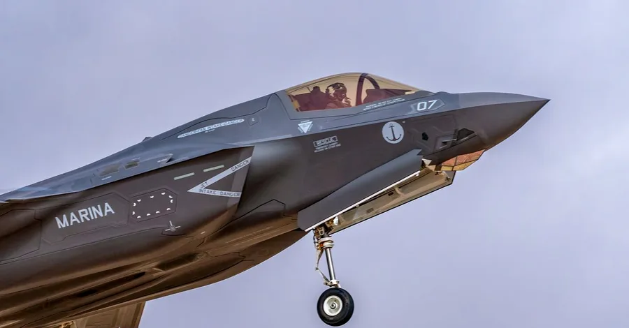 F-35 fighter jet soaring through the sky, showcasing modern military aviation technology.